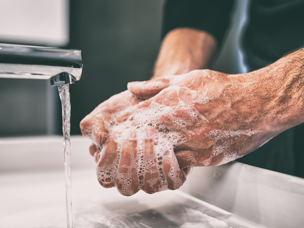 A Person washing their hands to prevent infection