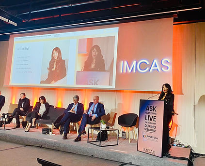 Vanessa Bird on stage presenting her lecture at IMCAS Paris 2024