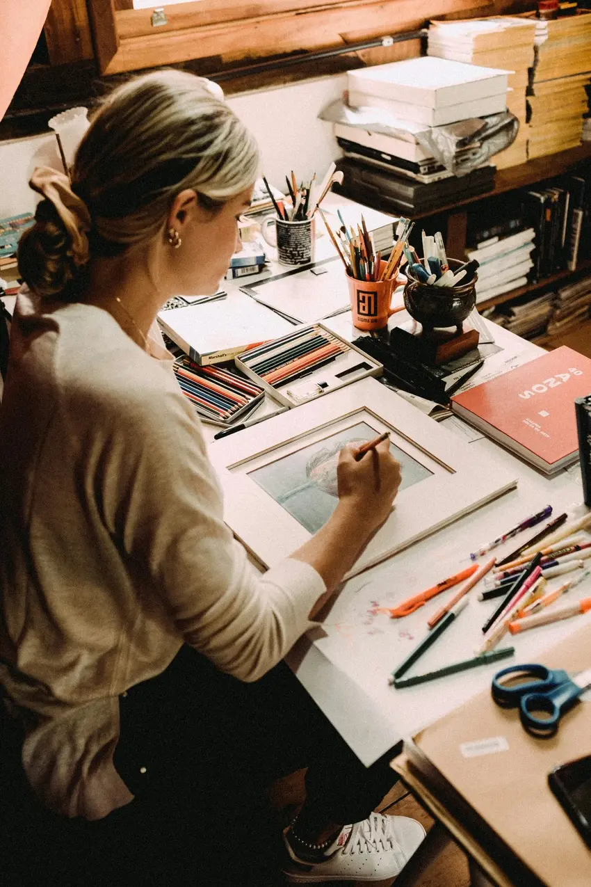 Local artist making a hand drawn artwork of a self portrait used as a unique gift idea for house warming and new neighbor for birthday or anniversary