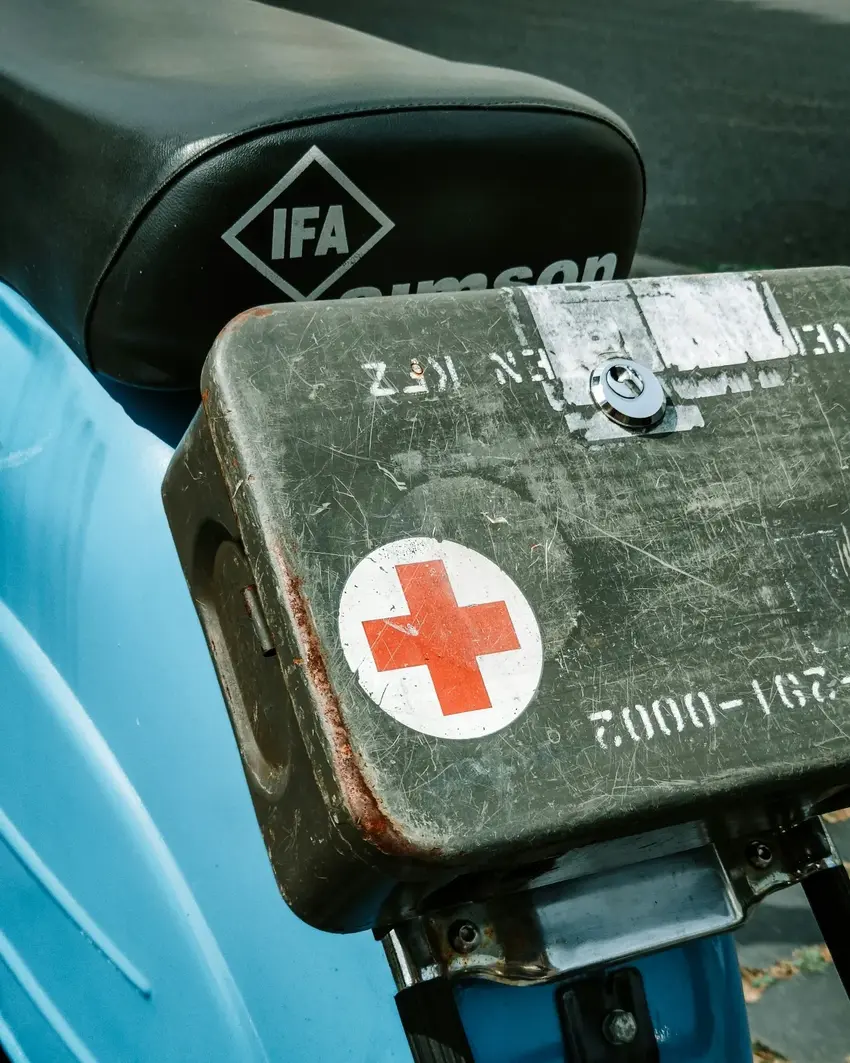 Humanitarian aid and donation symbol on worn metal case as important supplies are delivered to people in need after being donated as a caring gift and unique gift idea for the socially conscious and ecofriendly gift giver for friends and family who care about the planet and what they can do year round for gift ideas that are unique
