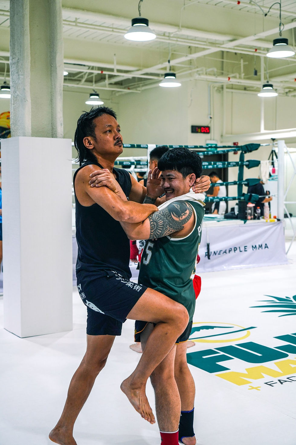 Clinch drilling in the ring at Pineapple MMA, 139 Cecil Street, Singapore