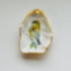 Painted bird on oyster shell dish