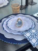 Blue and white place setting with ring