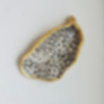Gold-rimmed petal dish, black and white spots