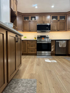 Full kitchen remodel featuring custom cabinets and updated finishes by Mustard Seed Remodeling.