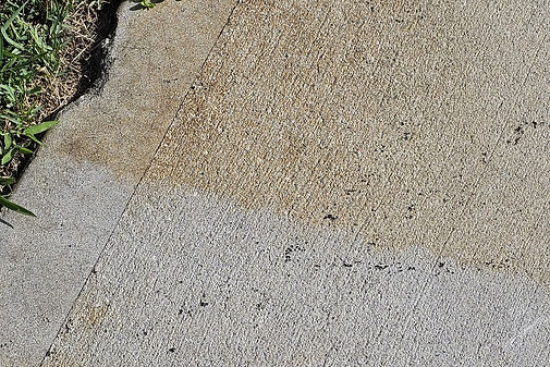 Driveway treated and untreated with Rust Funk Fix.JPG