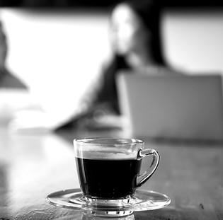 coffee-cup-deak-meeting-room-blurred-background-workers-are-sitting_edited.jpg
