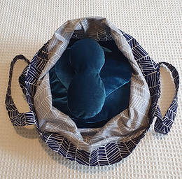 Image of bag holding heated and weighted pillows for an NA Touch session