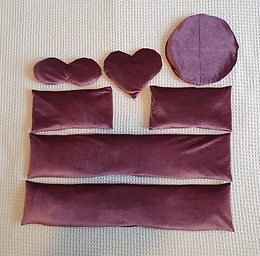 Image of purple weighted pillows used in NeuroAffective touch sessions.
