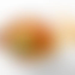 Colorful mango salsa in a white bowl with cilantro garnish, set on a white background with tortilla chips. Vibrant and fresh.