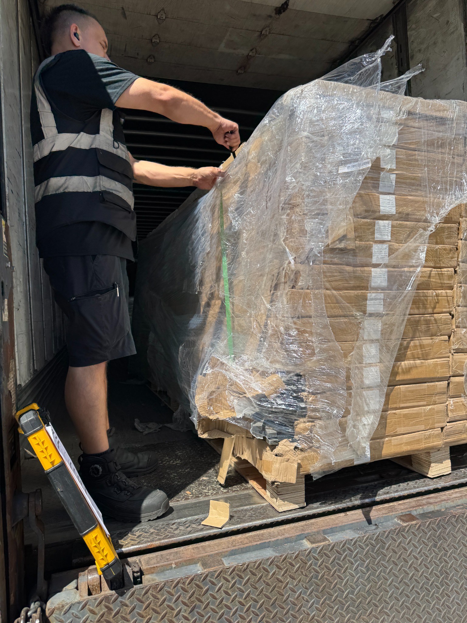 Original freight delivery photograph of boxed ten foot acoustic slat wall panels inside a truck