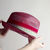 Chapeau de paille rouge et imprimé turquoise et vert