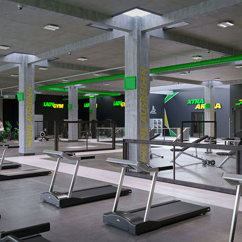 Ein modernes Fitnesscenter mit einer leuchtend grünen Fassade, großen Fenstern und einem einladenden Eingang. Mehrere Autos parken davor, und das Kommen und Gehen der Besucher sorgt für eine lebhafte Atmosphäre.