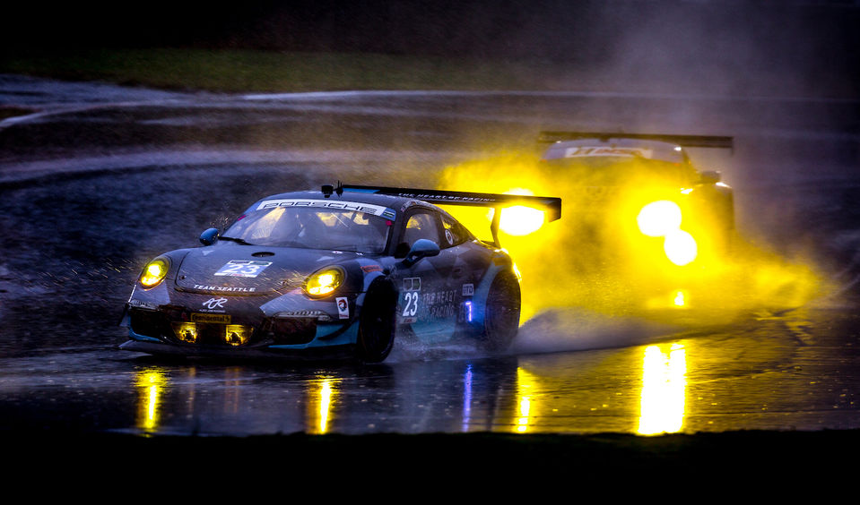 Porsche on flooded track during race