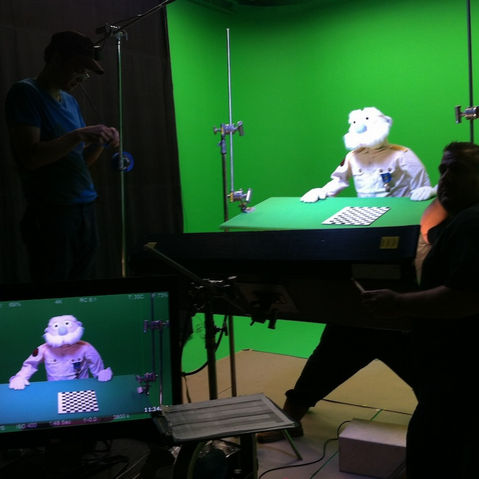 Puppet on green screen film set ready for take.