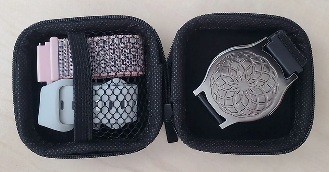 Travel Case with the Florella, both extra bands, and the Belly Button correctly packed inside to safely take them with you.
