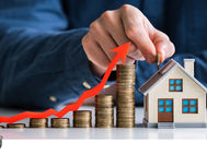 Hand places coin on increasing stacks next to house model. Red arrow indicates growth. Text reads "PASS CERTIFIED." Blue attire in background.