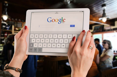 Someone holding a Google tablet.