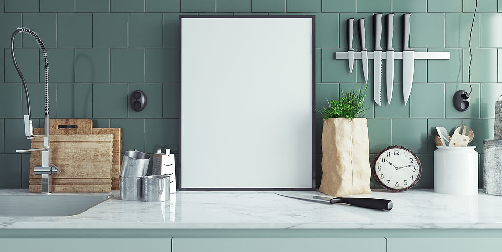 Kitchen counter with cutting boards, knives on a magnetic strip, and a clock. Green tiled wall, plant in a paper bag, and a faucet.