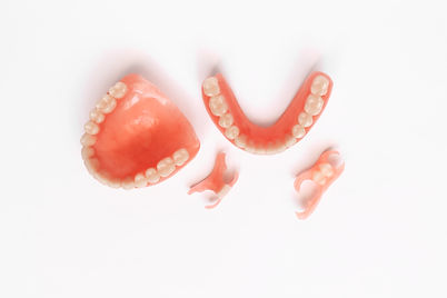 Dentures on a white background. Close-up of dentures. Dentistry is conceptual photography.