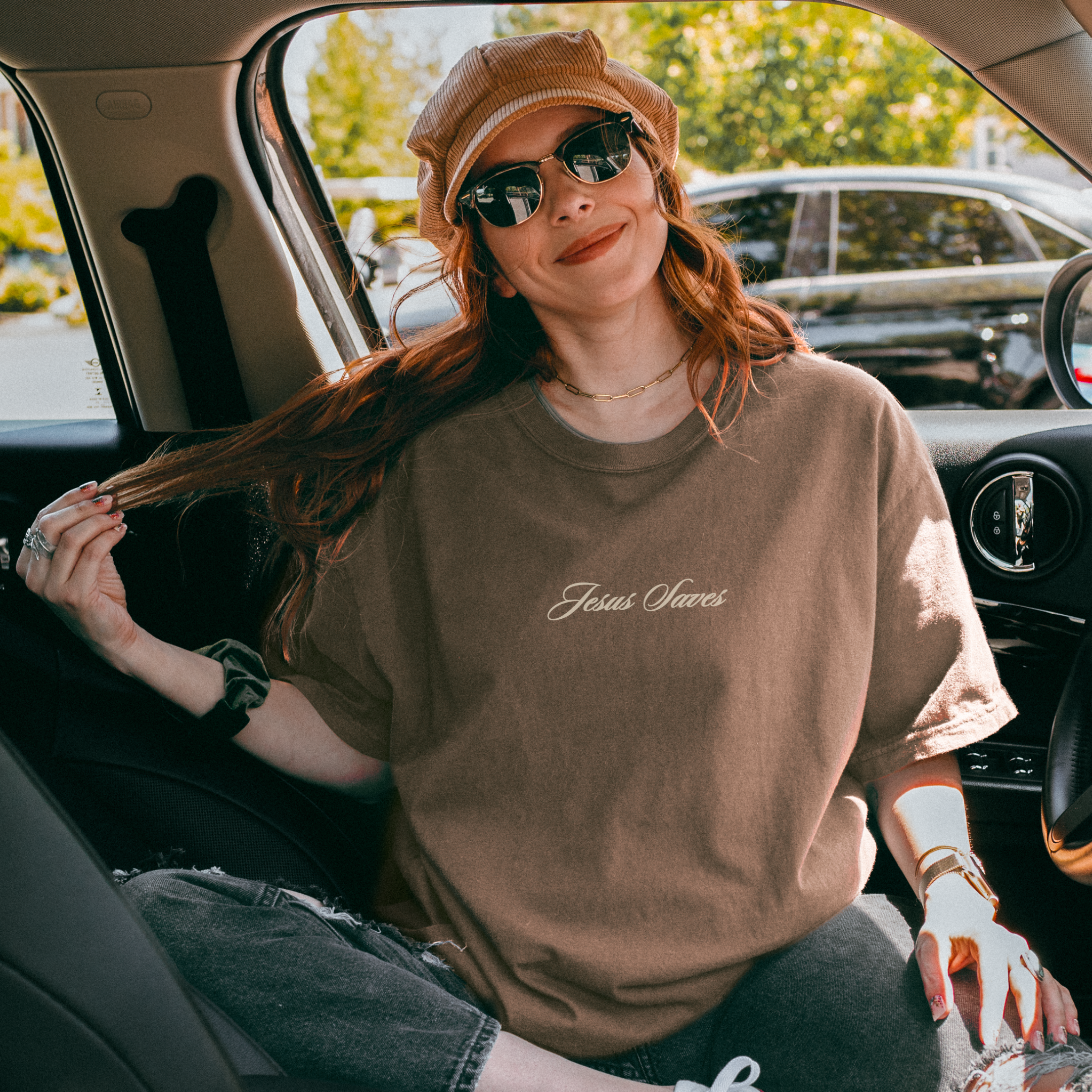 brown vintage look t shirt for men and women christian t shirt that says Jesus Saves, perfect for everyday wear