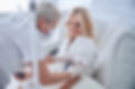 Side view portrait of happy cheerful talking with professional doctor while receiving IV i