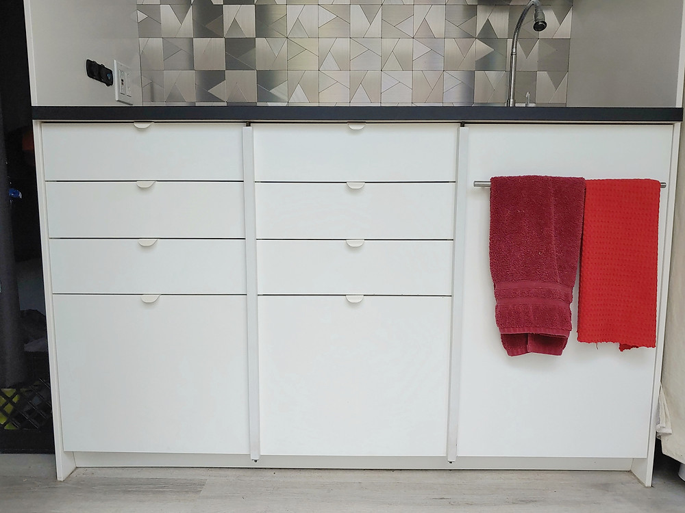 Our van's Ikea cabinet kitchen with simple and easy vertical drawer and door locks. #vanconversionideas