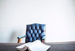 Executives desk, chair and book