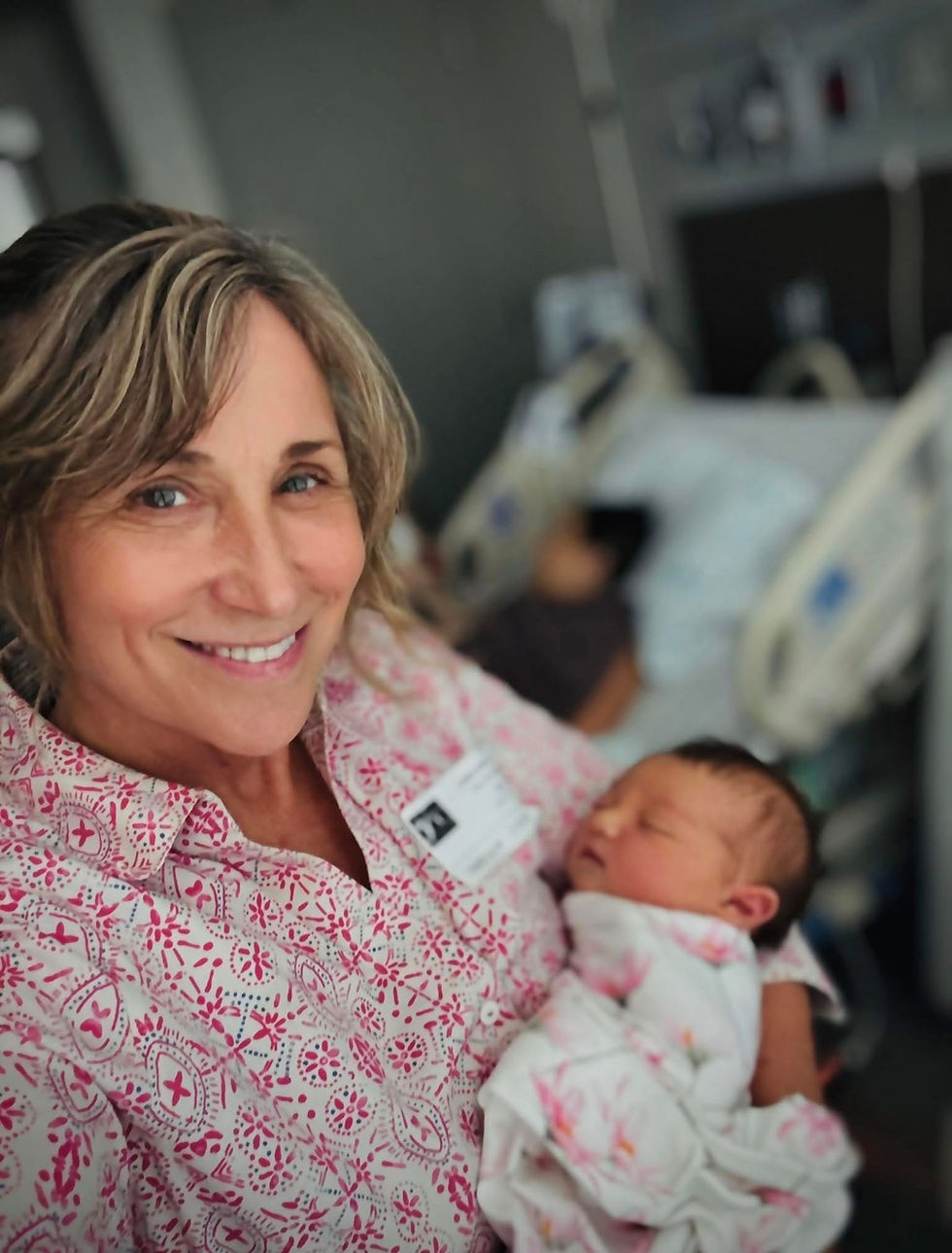Karen holding her newborn baby