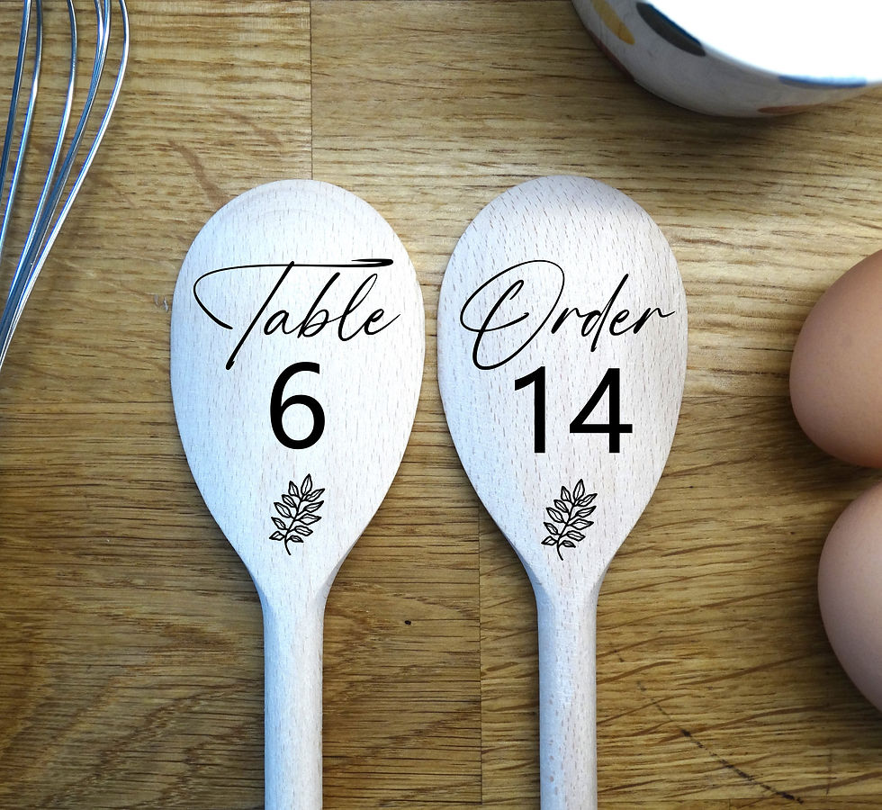 pair of wooden spoons with engraved leaves and then Table number and Order number. To show example as a table sign