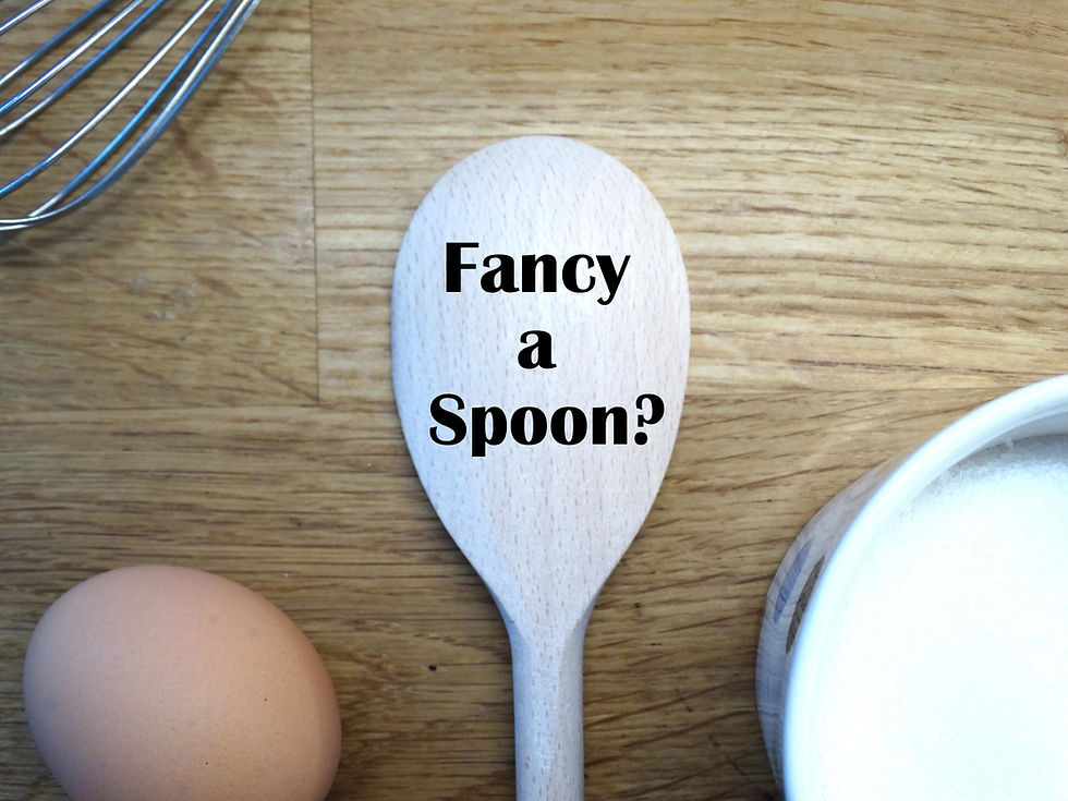 wooden spoon with text "fancy a spoon?" engraved. Example of funny anniversary gift for chefs and bakers