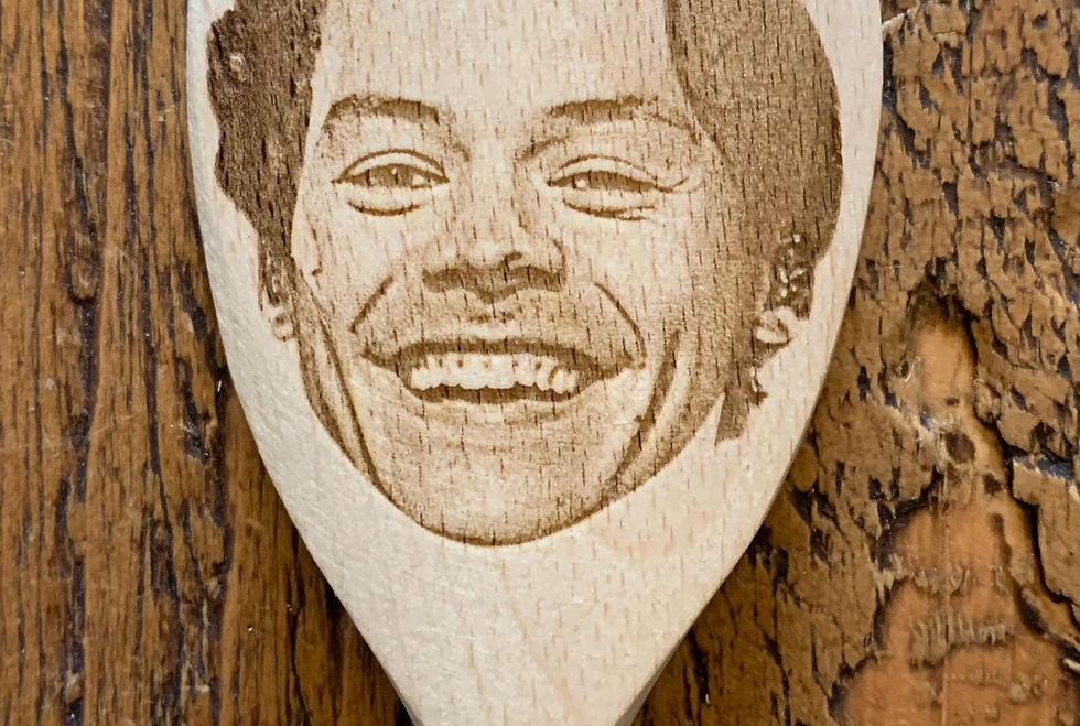 Thumbnail: Example of a face engraved, from a photo, on a wooden spoon.