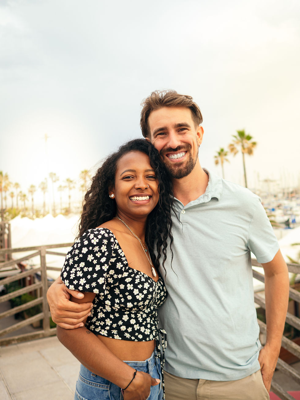 Cheerful couple smiling together, reflecting happiness, unity, and financial stability