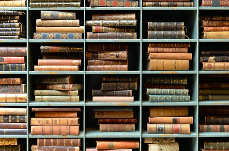 rare and antique books waiting to be rebound and repaired by our bookbinder