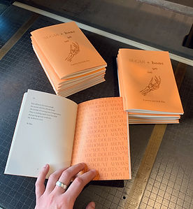 Poetry chapbook interior layout and design being showcased in an open book