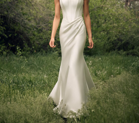 Astra Bridal spaghetti-strap satin wedding gown with a fitted bodice, shown from the shoulders down