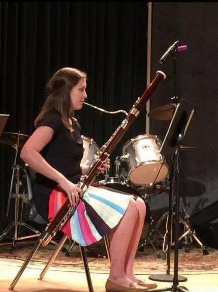 Victoria as a high school student, performing on her bassoon.