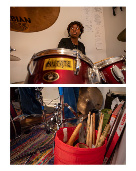 Top photo: Chris sits at the second-hand drum throne of the drum kit she uses. 