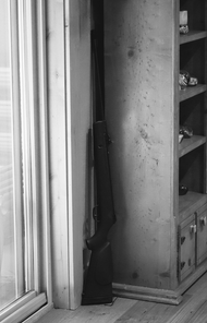 A rifle kept behind the screen door of my grandparent’s home, where it remains at all times.