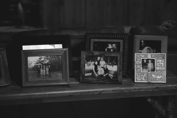 One of serveral surfaces in my grandmother’s home covered with framed photographs.