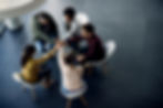view-group-therapy-participants-holding-hands-unity-meeting.jpg