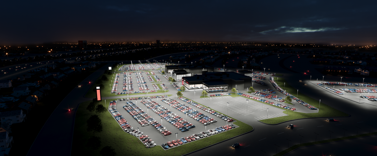 Nighttime car dealership in the United States with exterior lighting covering sales and parking zones.