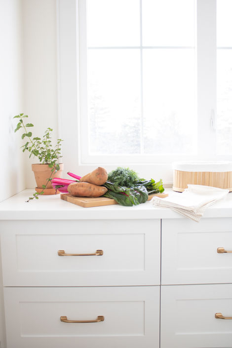 Brass kitchen cabinet hardware blends seamlessly with this PEI kitchen design