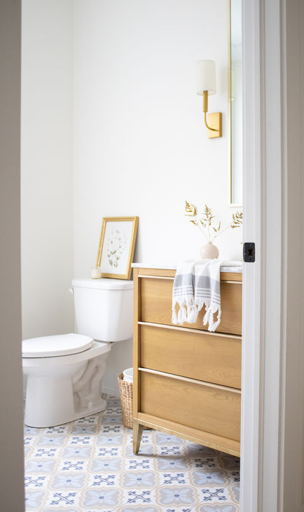Modern bathroom design with clean white touches and tile flooring