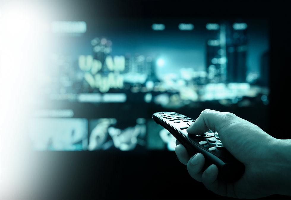 Person holding remote to change channel on television in background with teal overly.