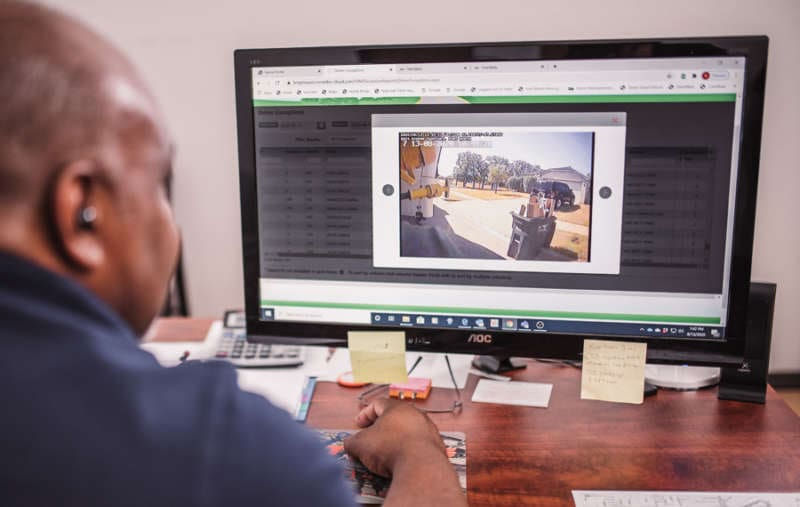 Man using desktop to access on-board fleet camera