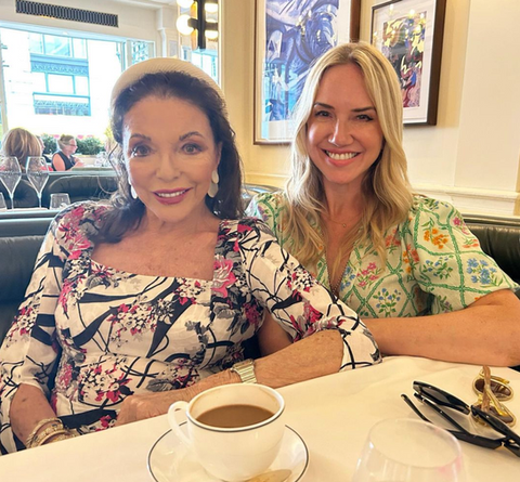 Rosie posing with friend in a cafe