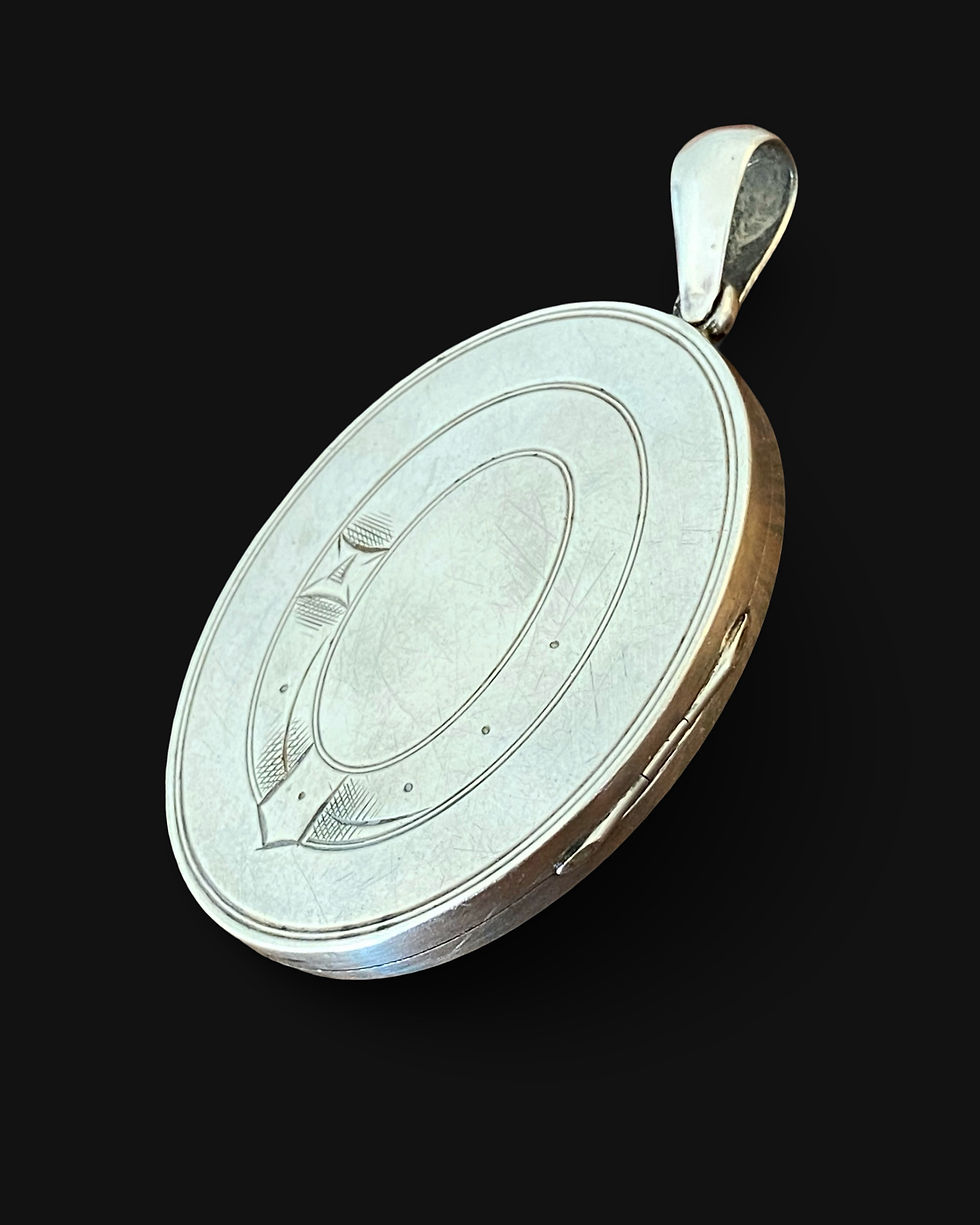 Thumbnail: Antique Silver Garter And Monogram Locket 