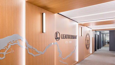 Modern wood clad hallway with Leatherman branding.