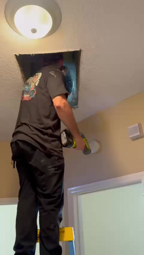 Air duct cleaning technician inspecting HVAC duct in Boston home